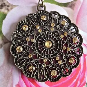 Filigree pendant peach orange gems dark metal